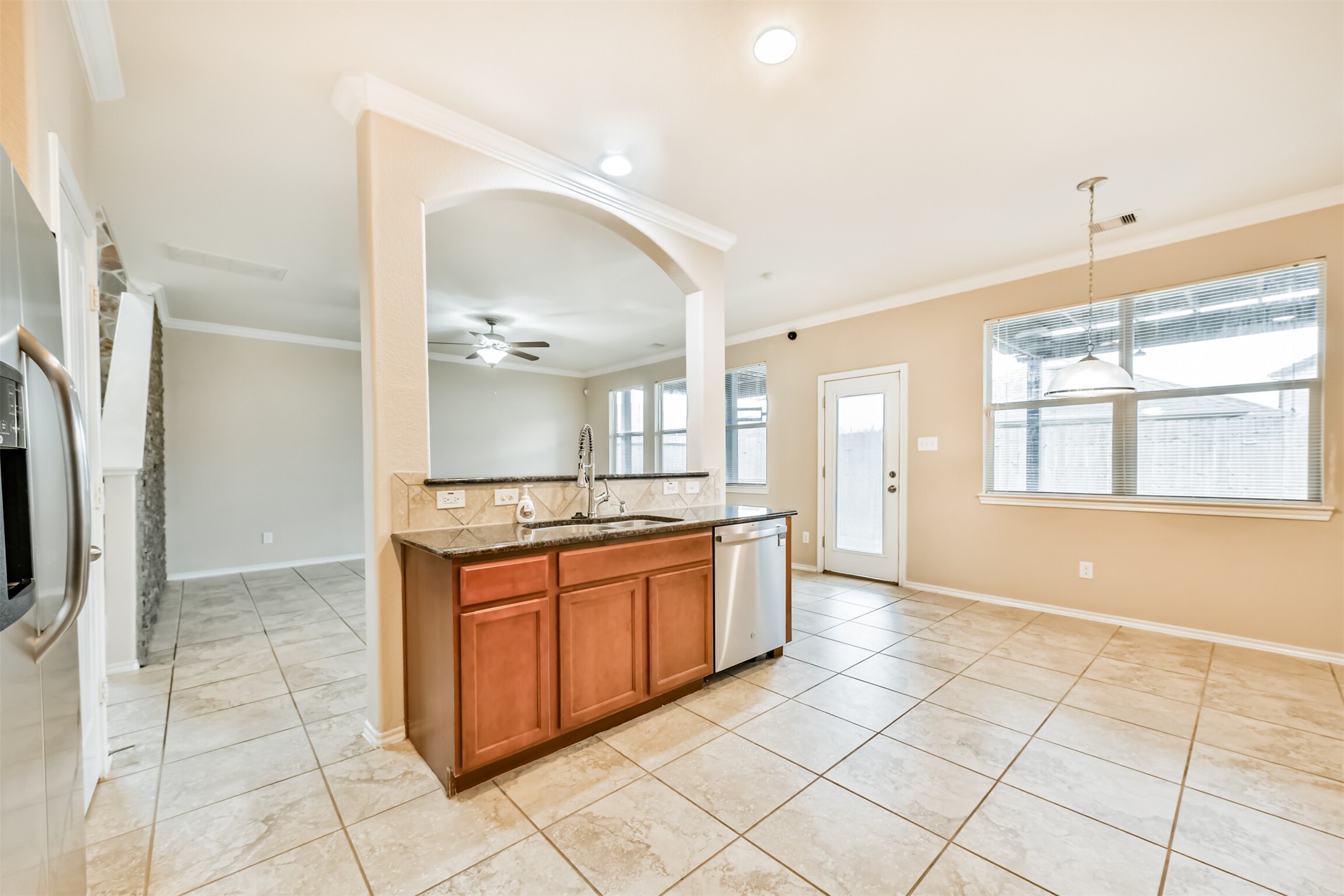 3041 Heather Grove Lane Dickinson, TX 77539 - Photo 13 of 37 a large kitchen with stainless steel appliances granite countertop a stove a sink and a refrigerator
