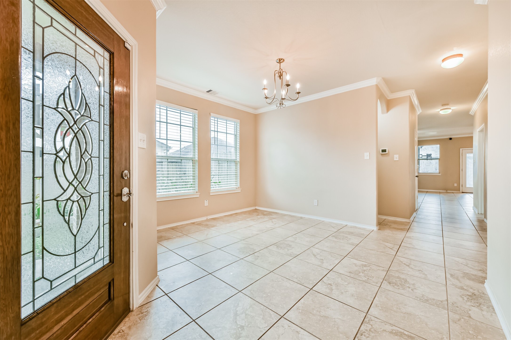 3041 Heather Grove Lane Dickinson, TX 77539 - Photo 15 of 37 a view of an entryway with a chandelier