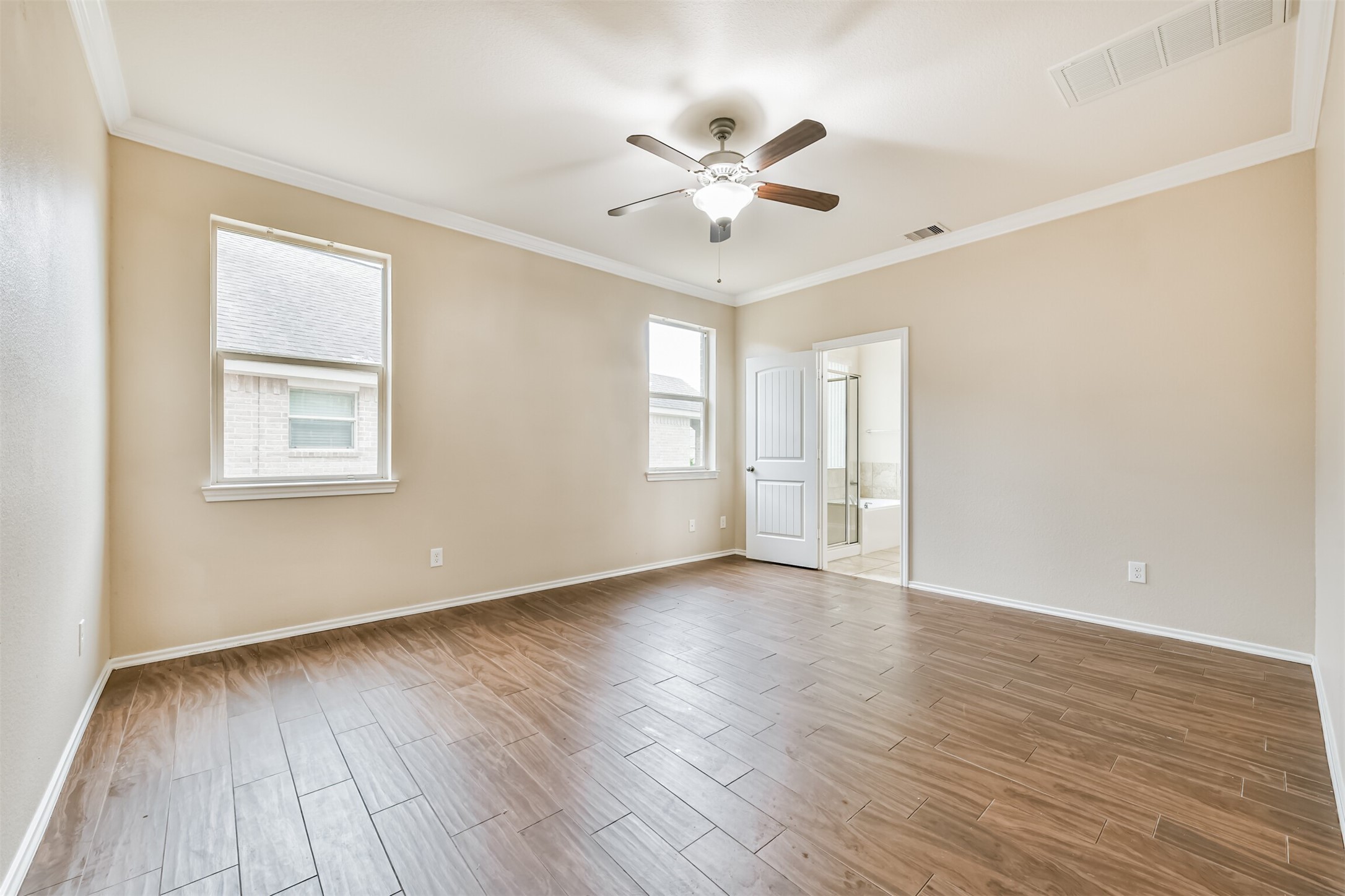 3041 Heather Grove Lane Dickinson, TX 77539 - Photo 18 of 37 a view of an empty room with wooden floor and a window