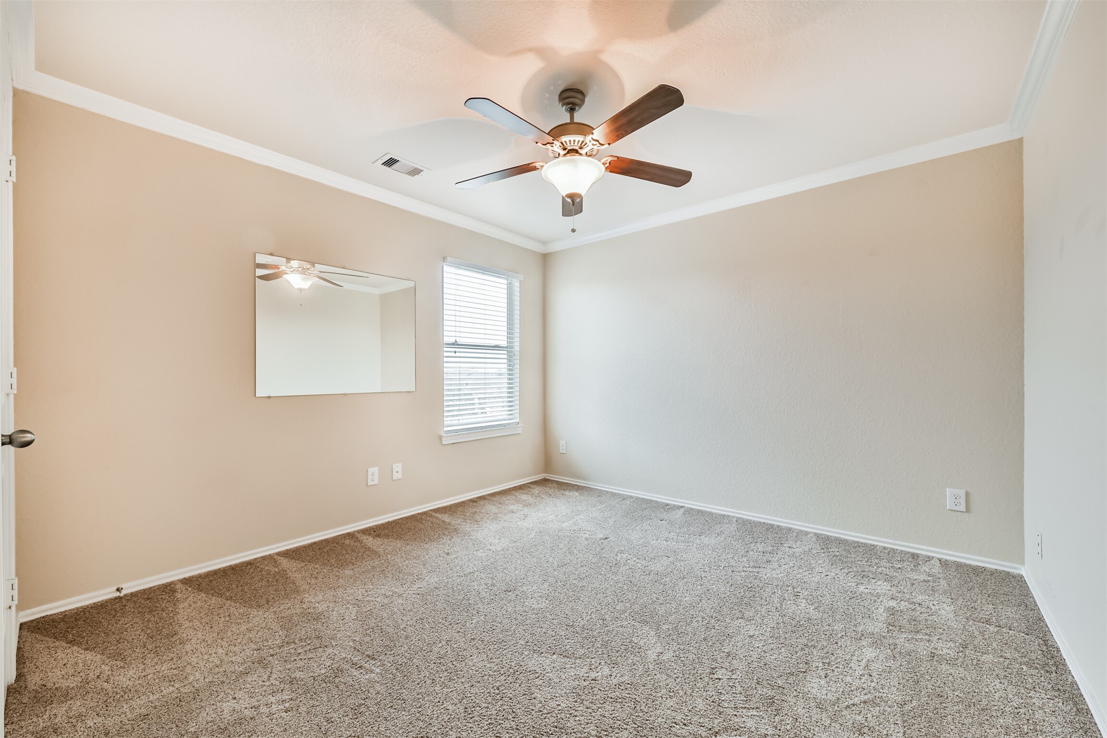 3041 Heather Grove Lane Dickinson, TX 77539 - Photo 32 of 37 an empty room with window and ceiling fan