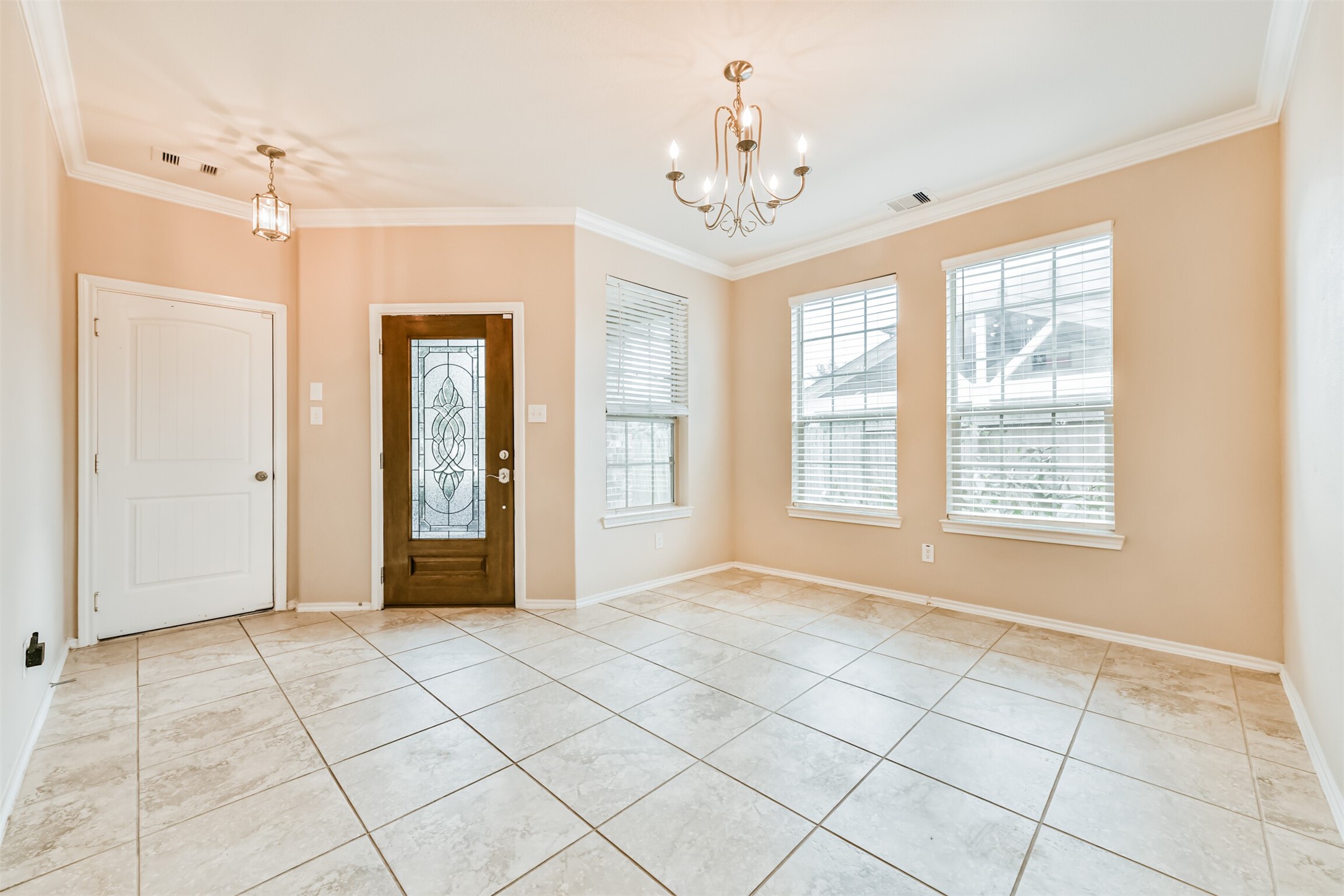 3041 Heather Grove Lane Dickinson, TX 77539 - Photo 6 of 37 a view of an empty room with window and chandelier fan