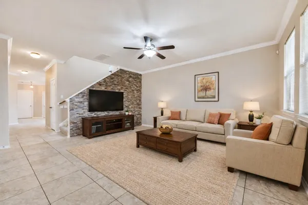 a living room with furniture and a flat screen tv