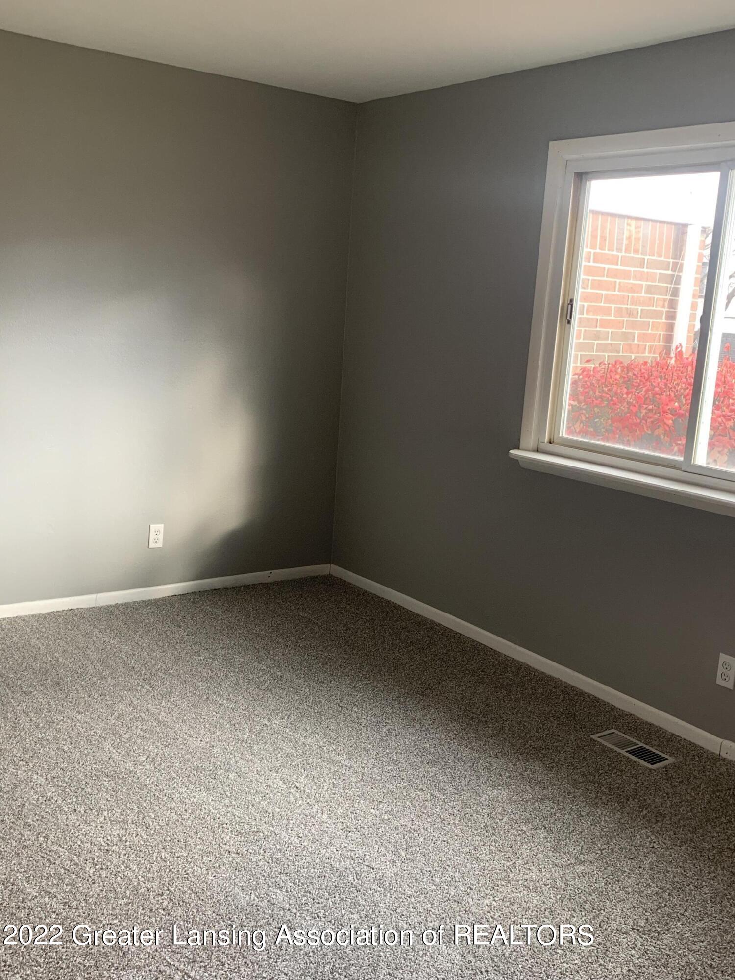 3946 Hunters Ridge Drive, Unit 1 Lansing, MI 48911 - Photo 9 of 12 Master Bedroom