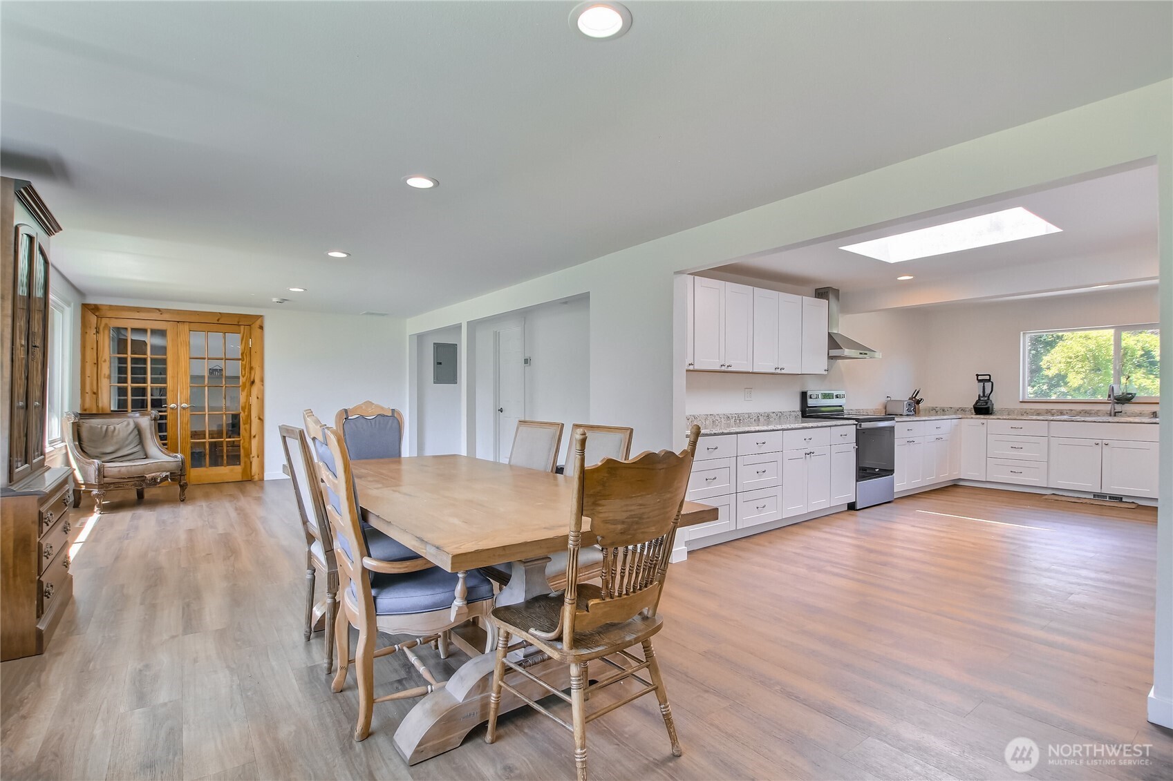 13610 Southeast 288th Street Kent, WA 98042 - Photo 18 of 32 a view of a dining room with furniture and wooden floor