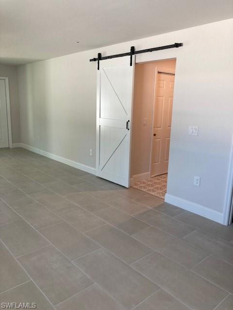 3838 Kelly Street Fort Myers, FL 33901 - Photo 14 of 15 an empty room with an entryway and shower