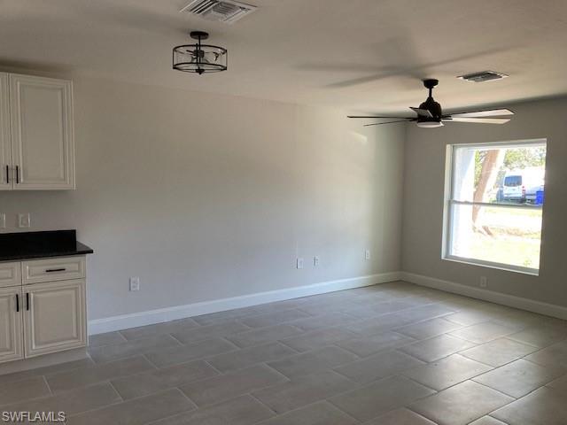 3838 Kelly Street Fort Myers, FL 33901 - Photo 15 of 15 an empty room with windows and fan