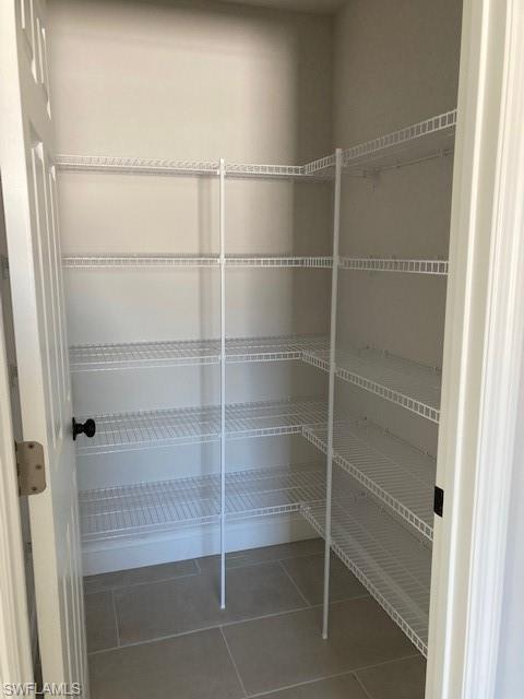 3838 Kelly Street Fort Myers, FL 33901 - Photo 6 of 15 a room with walk in closet and empty racks