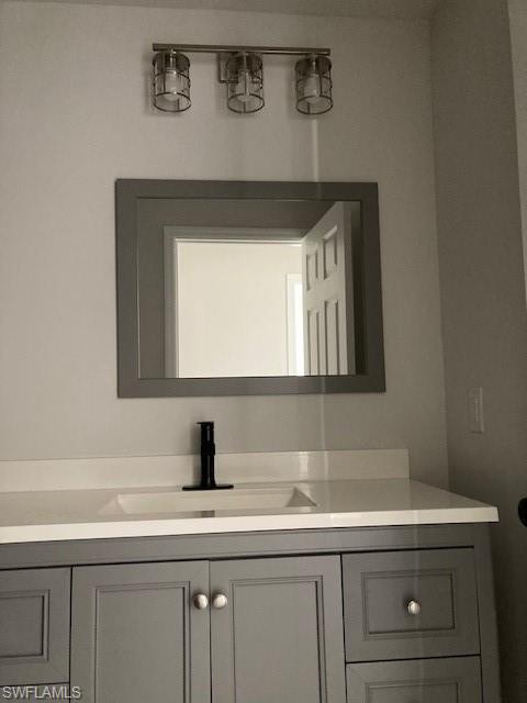 3838 Kelly Street Fort Myers, FL 33901 - Photo 7 of 15 a bathroom with a sink and a mirror