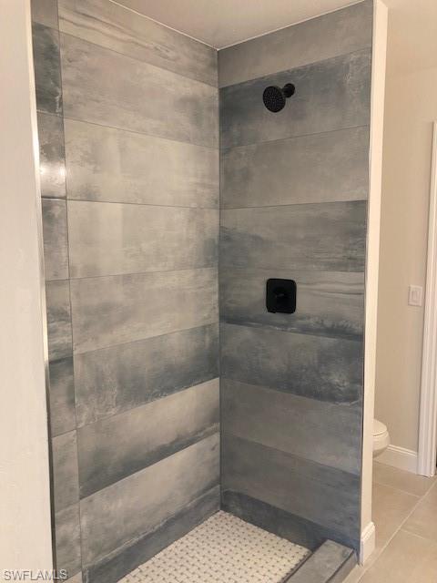 3838 Kelly Street Fort Myers, FL 33901 - Photo 9 of 15 a bathroom with a glass shower door