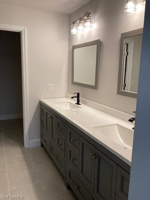 3838 Kelly Street Fort Myers, FL 33901 - Photo 10 of 15 a spacious bathroom with double sink and a mirror