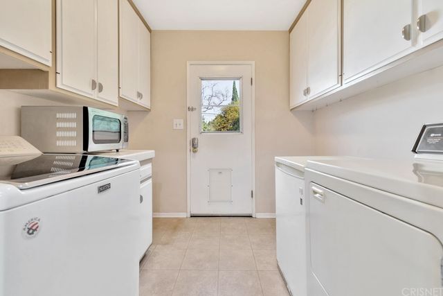a view of cabinets and window