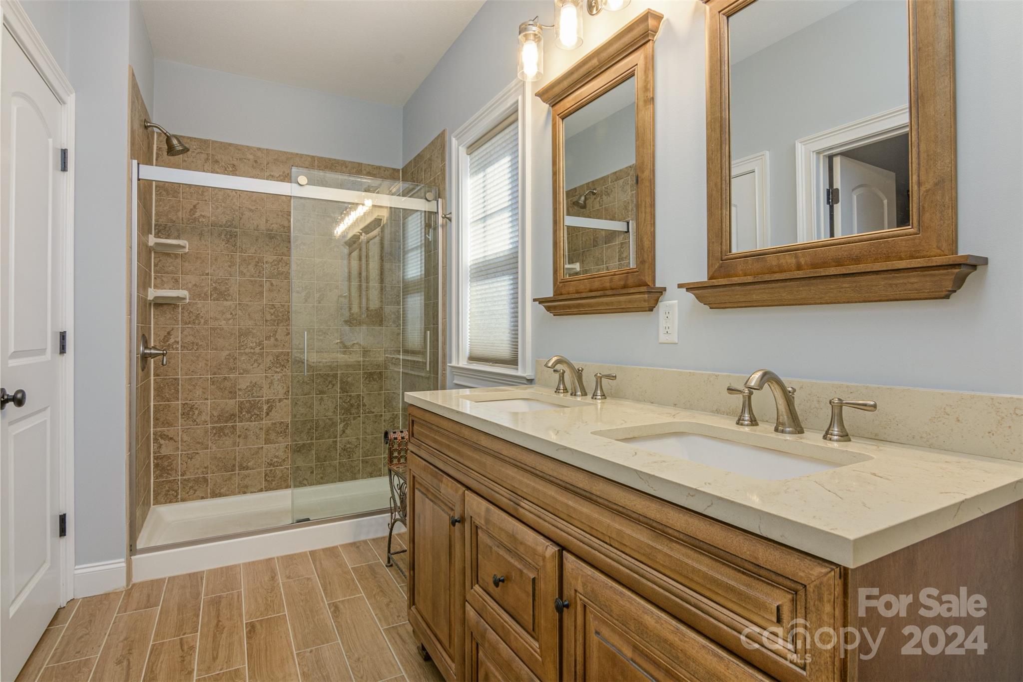 47 Asher Lane Arden, NC 28704 - Photo 19 of 34 a bathroom with a sink and a mirror