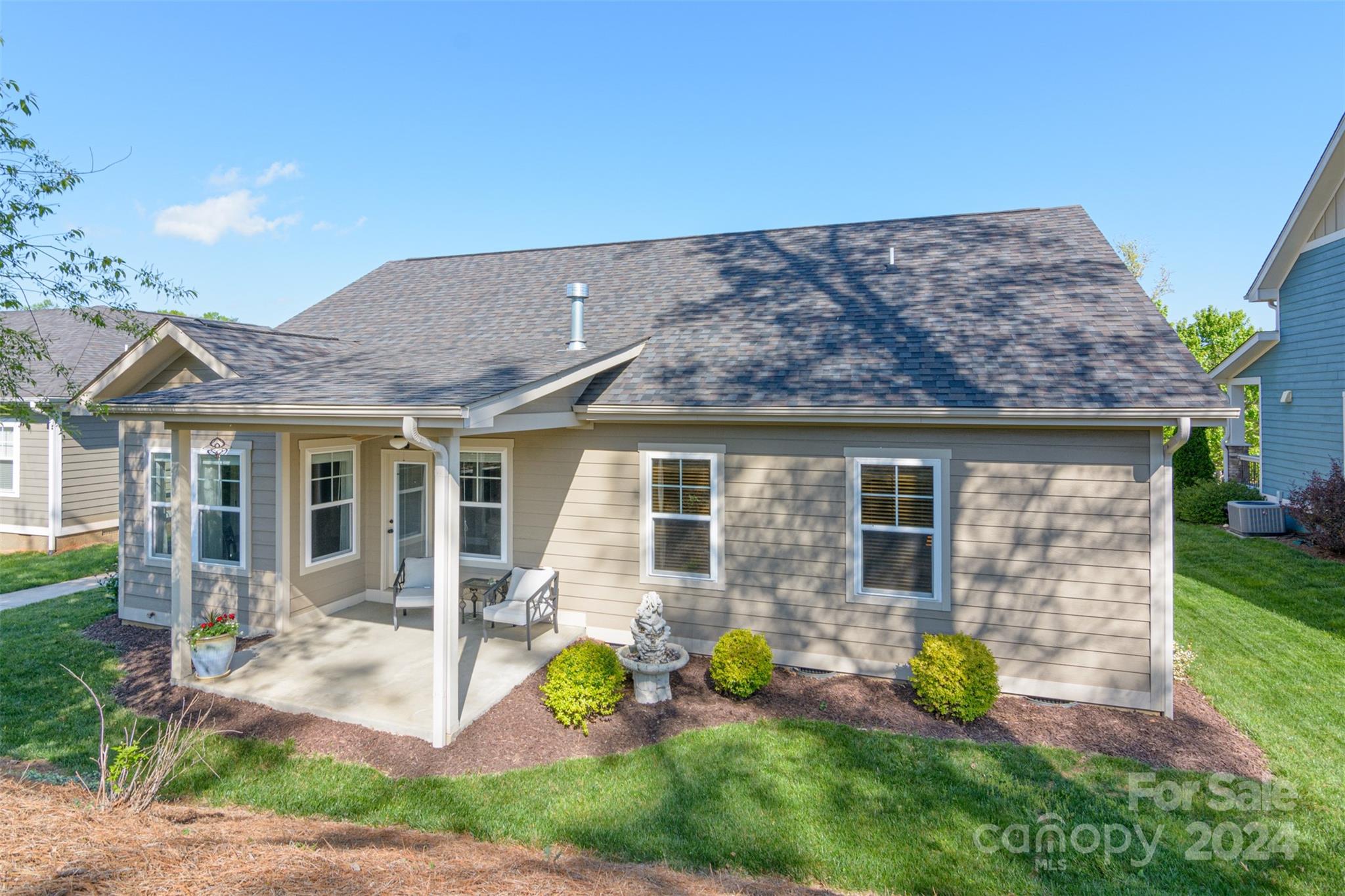 47 Asher Lane Arden, NC 28704 - Photo 27 of 34 a front view of a house with garden