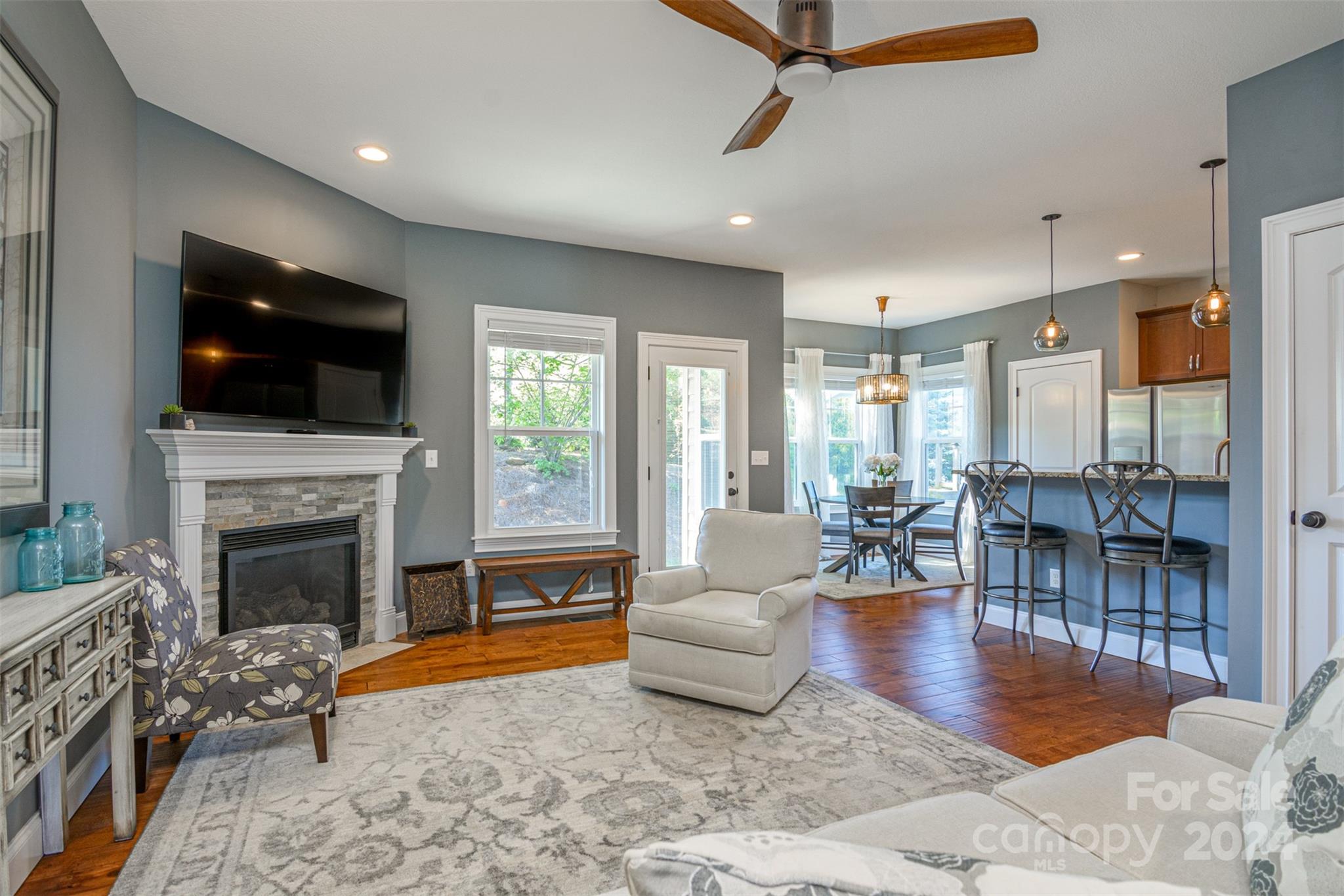 47 Asher Lane Arden, NC 28704 - Photo 6 of 34 a living room with fireplace furniture and a flat screen tv