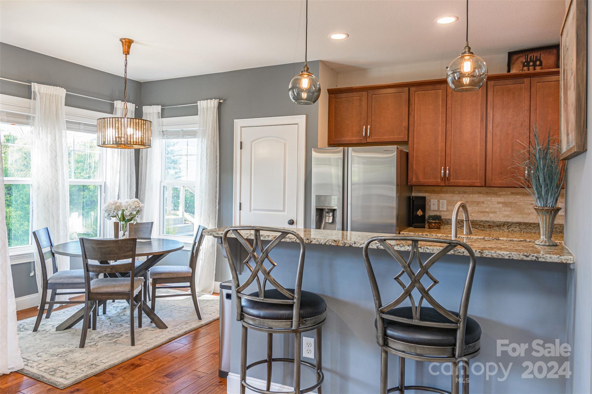47 Asher Lane Arden, NC 28704 - Photo 10 of 34 a view of a dining room with furniture window and wooden floor
