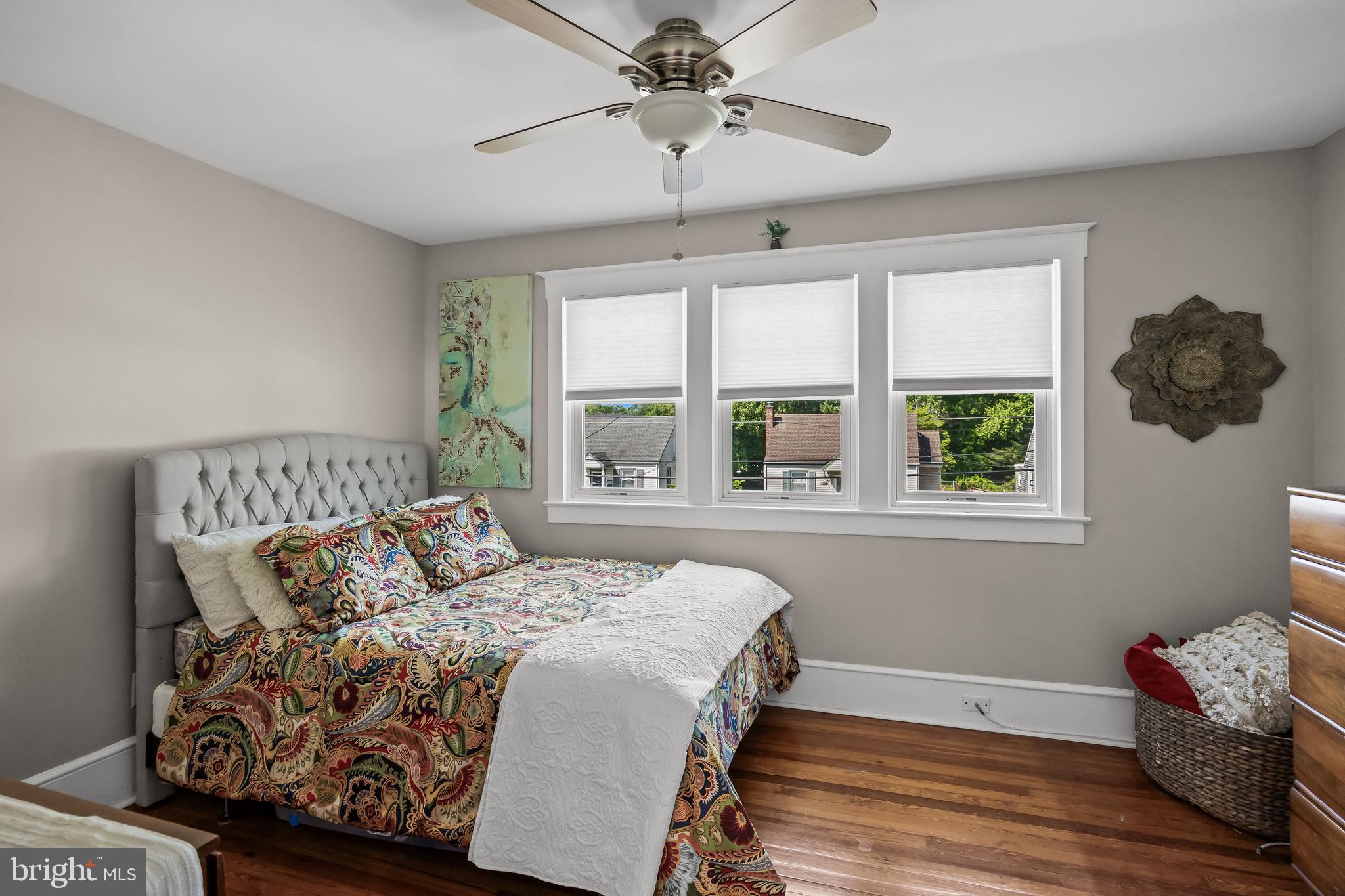 615 North Walnut Avenue Magnolia, NJ 08049 - Photo 19 of 40 a bedroom with a bed and a window