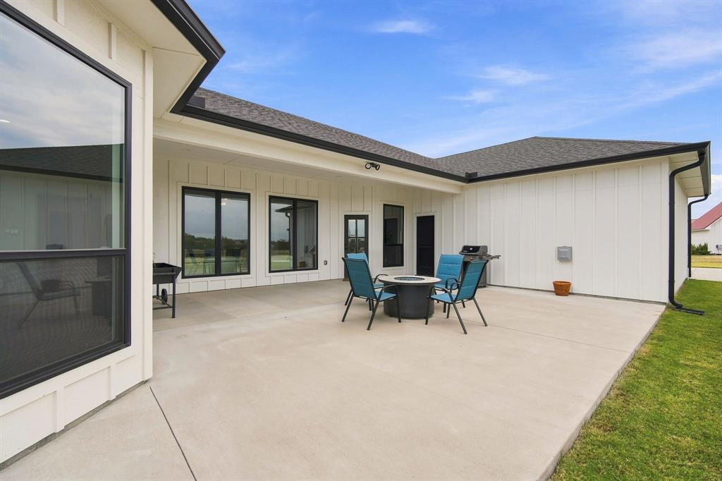140 Lone Elm Road Midlothian, TX 76065 - Photo 27 of 36 Spacious covered patio looking out on green pastures.
