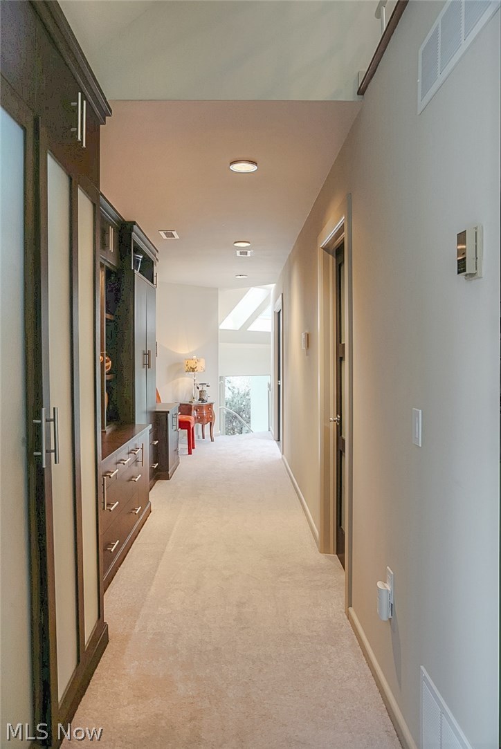 3740 Granger Road Akron, OH 44333 - Photo 19 of 33 Master Suite level hallway, built-ins on left, Landry room and walk-in closet on right