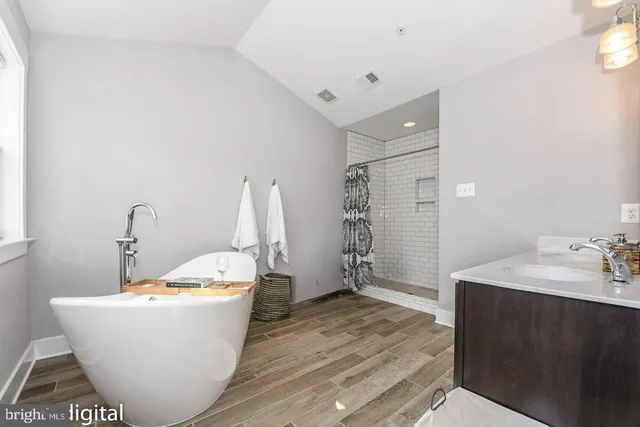 a white bath tub sitting in a bathroom