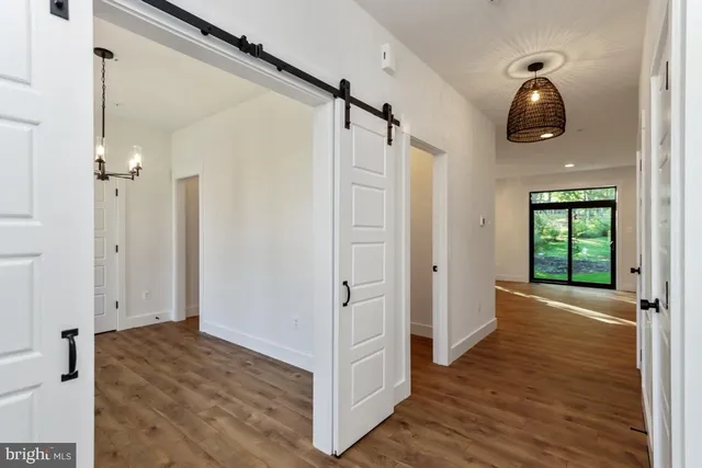 a view of empty room and wooden floor