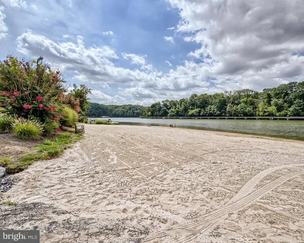 a view of outside space with wooden floor and lake view