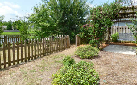 96050 Starlight Lane Yulee, FL 32097 - Photo 19 of 24 a view of a pathway with a garden