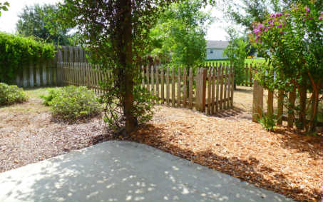 96050 Starlight Lane Yulee, FL 32097 - Photo 20 of 24 a wooden fence with trees in the background
