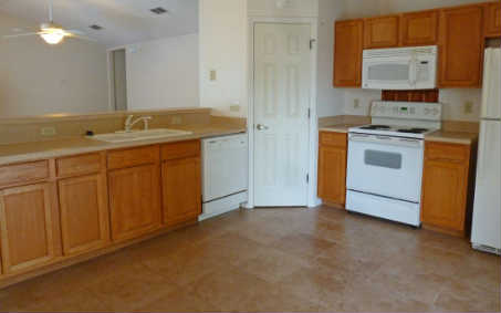 96050 Starlight Lane Yulee, FL 32097 - Photo 8 of 24 a kitchen with stainless steel appliances granite countertop a sink and a stove