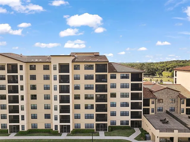 a view of a swimming pool with a yard