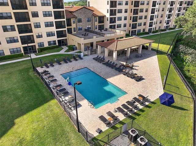 a view of a hallway with a livingroom and workspace