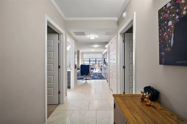 a large kitchen with stainless steel appliances lots of counter space a sink and furniture