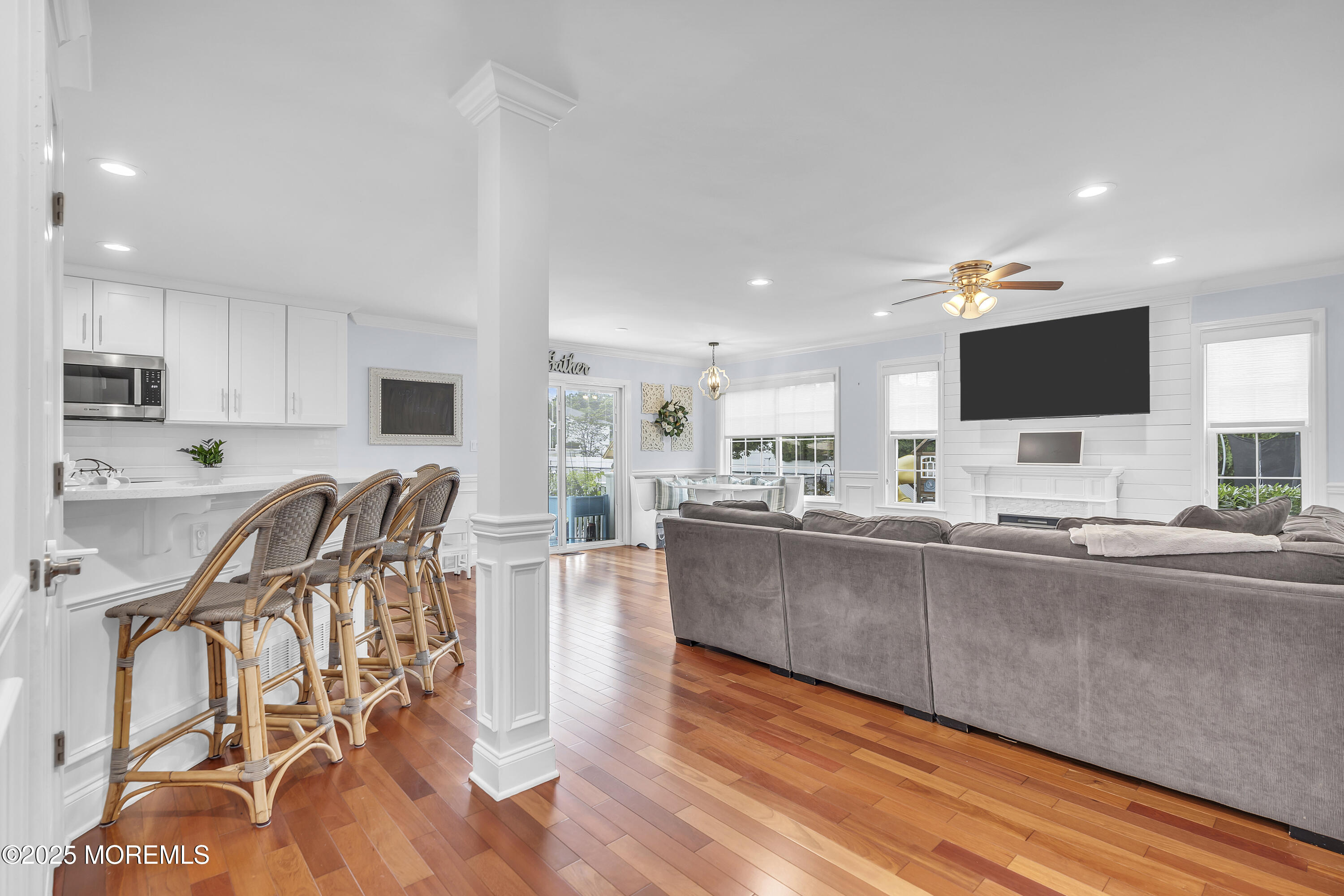 4 Rainbow Drive Howell, NJ 07731 - Photo 13 of 38 a living room with stainless steel appliances kitchen island granite countertop lots of furniture and wooden floor