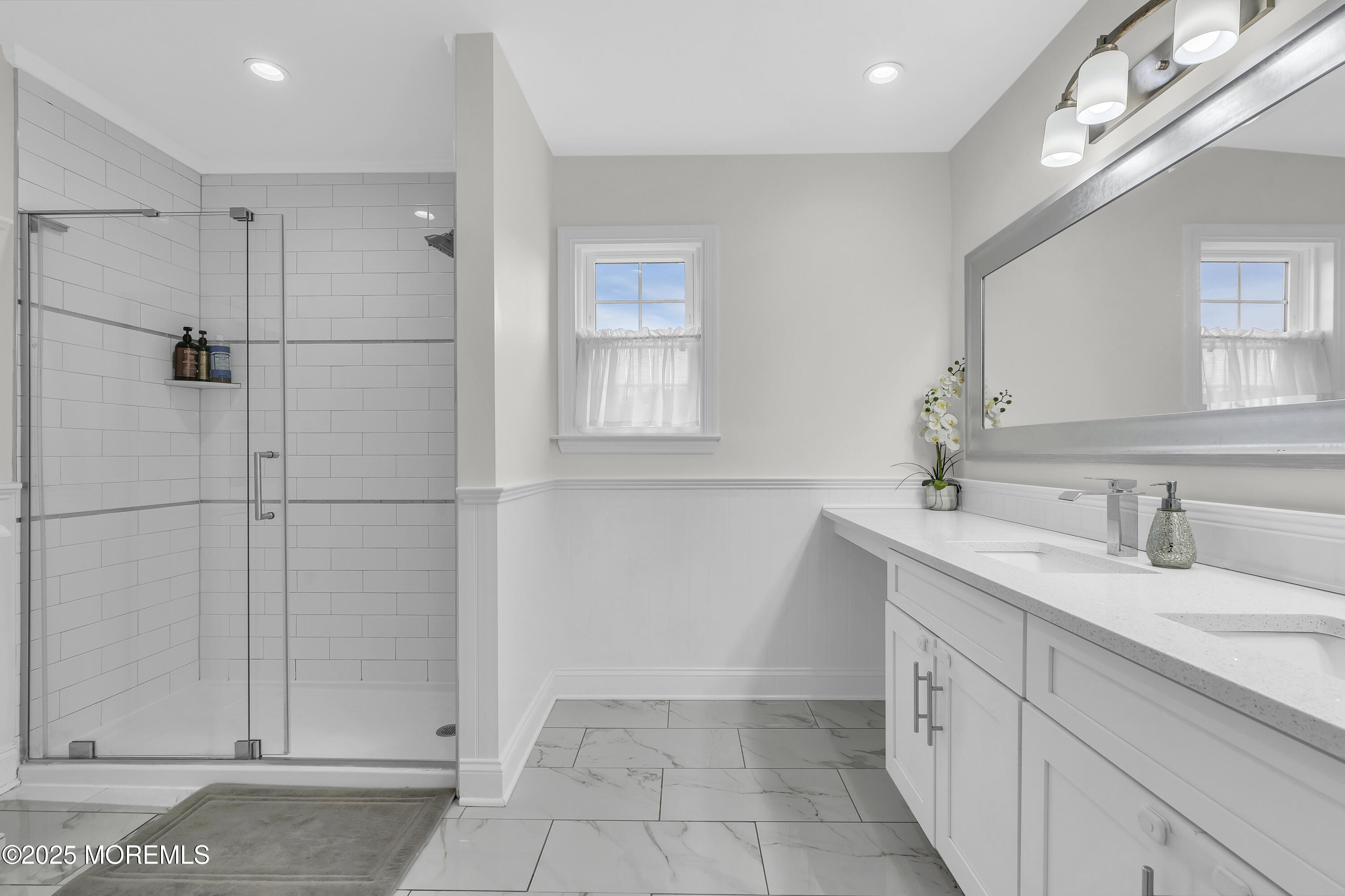 4 Rainbow Drive Howell, NJ 07731 - Photo 15 of 38 a bathroom with a double vanity sink a mirror and shower
