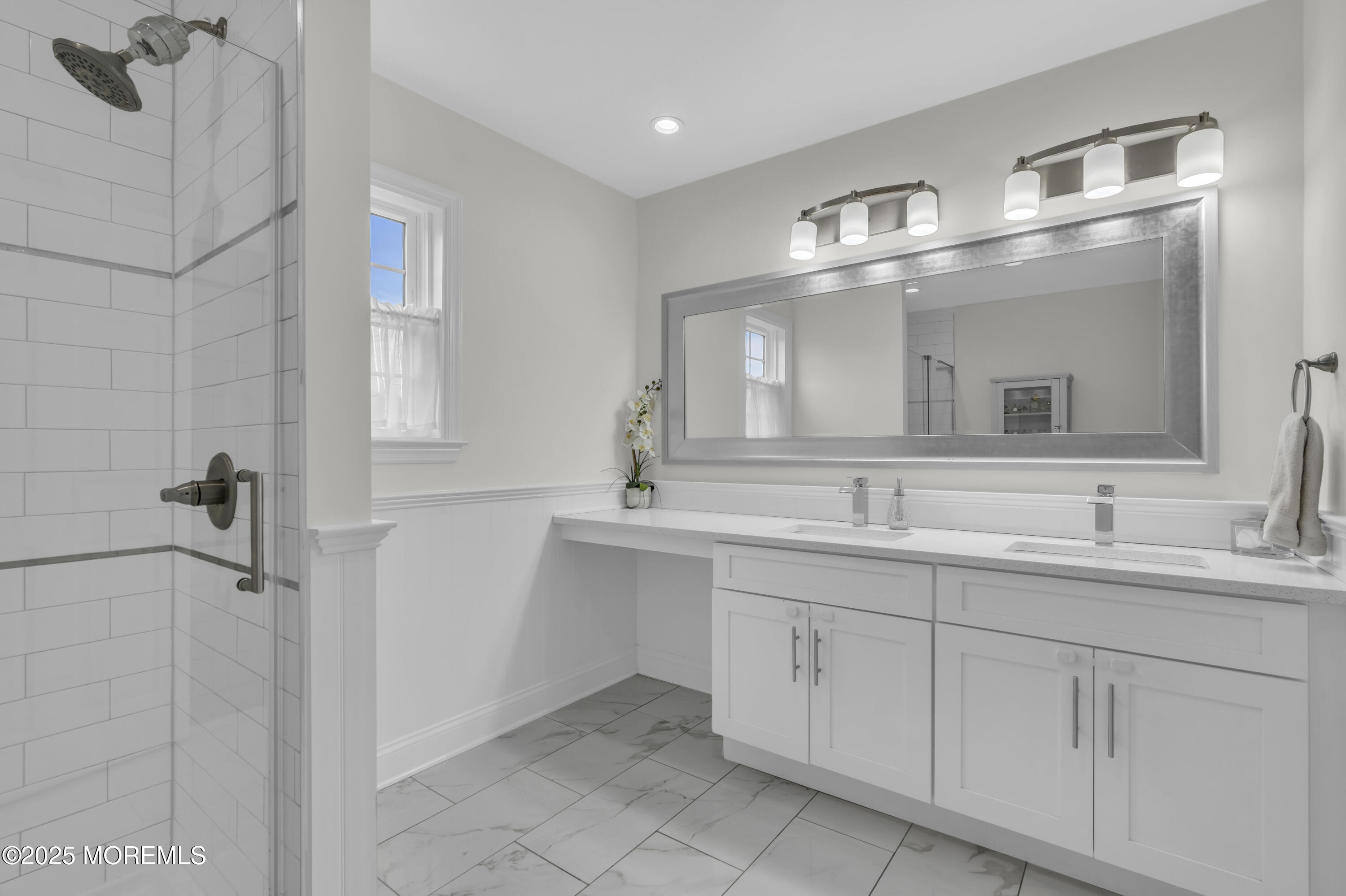 4 Rainbow Drive Howell, NJ 07731 - Photo 16 of 38 a bathroom with double sink and a mirror