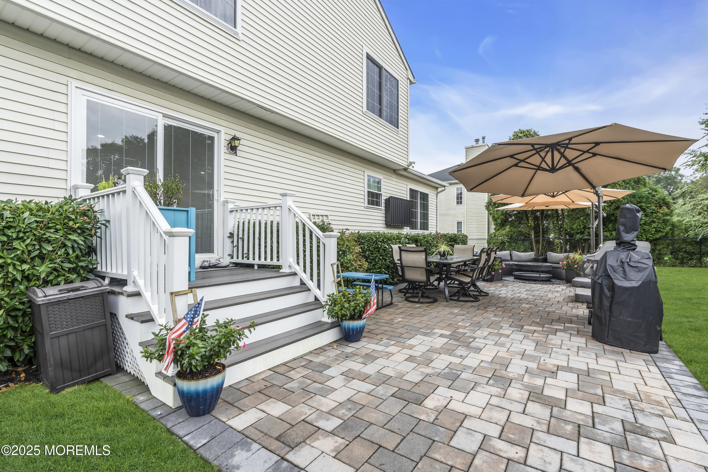 4 Rainbow Drive Howell, NJ 07731 - Photo 24 of 38 a view of a chair and tables in the patio