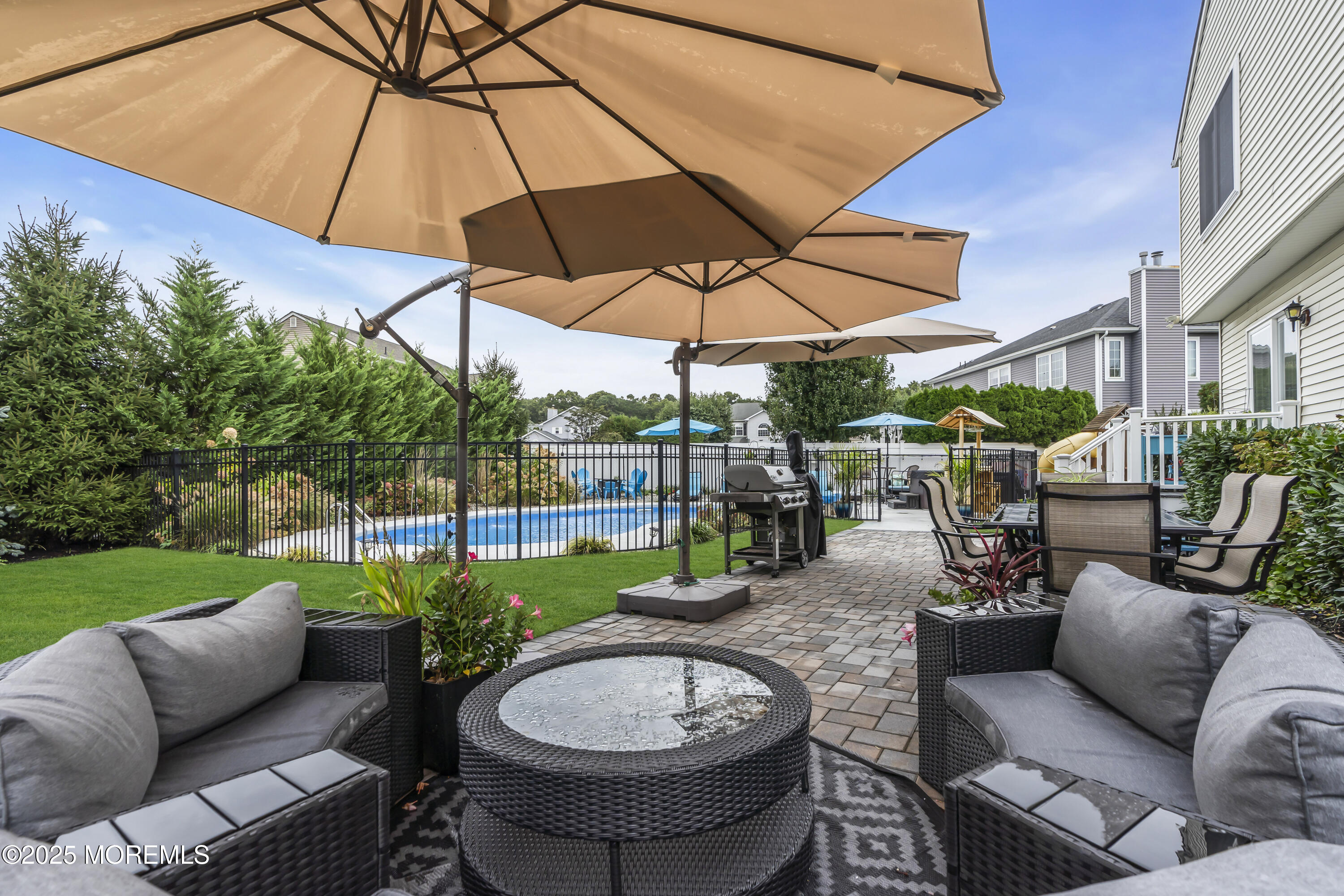 4 Rainbow Drive Howell, NJ 07731 - Photo 25 of 38 a view of a backyard with swimming pool and furniture