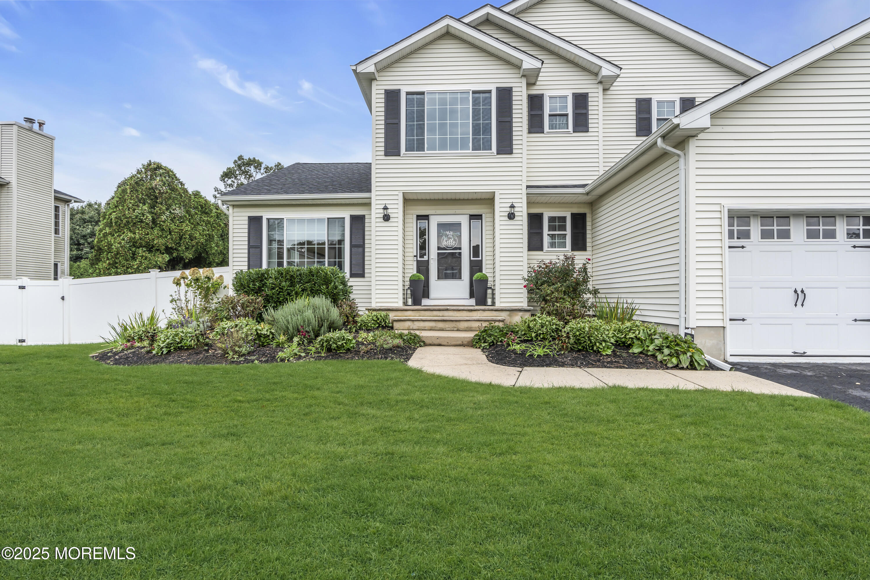 4 Rainbow Drive Howell, NJ 07731 - Photo 34 of 38 a front view of a house with a yard