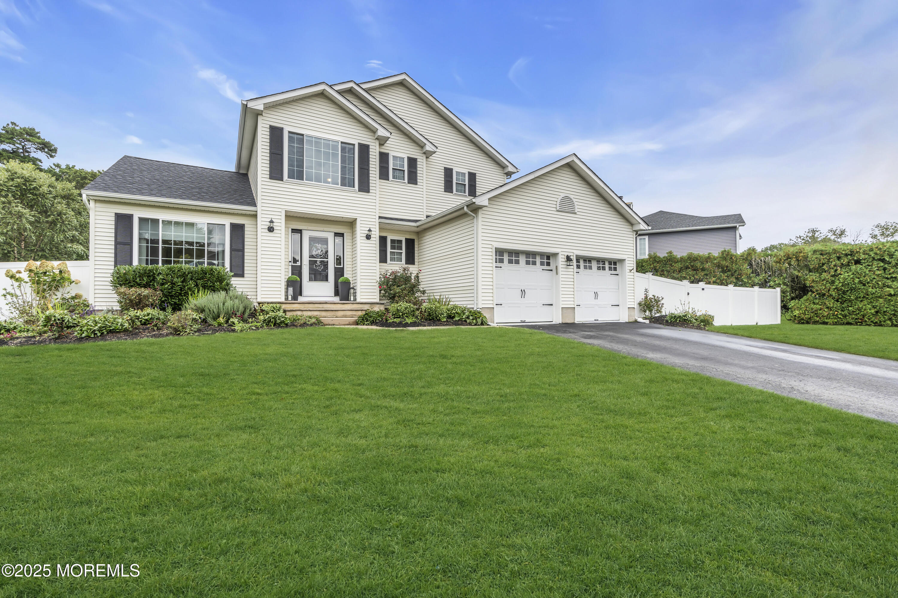 4 Rainbow Drive Howell, NJ 07731 - Photo 35 of 38 a front view of a house with garden