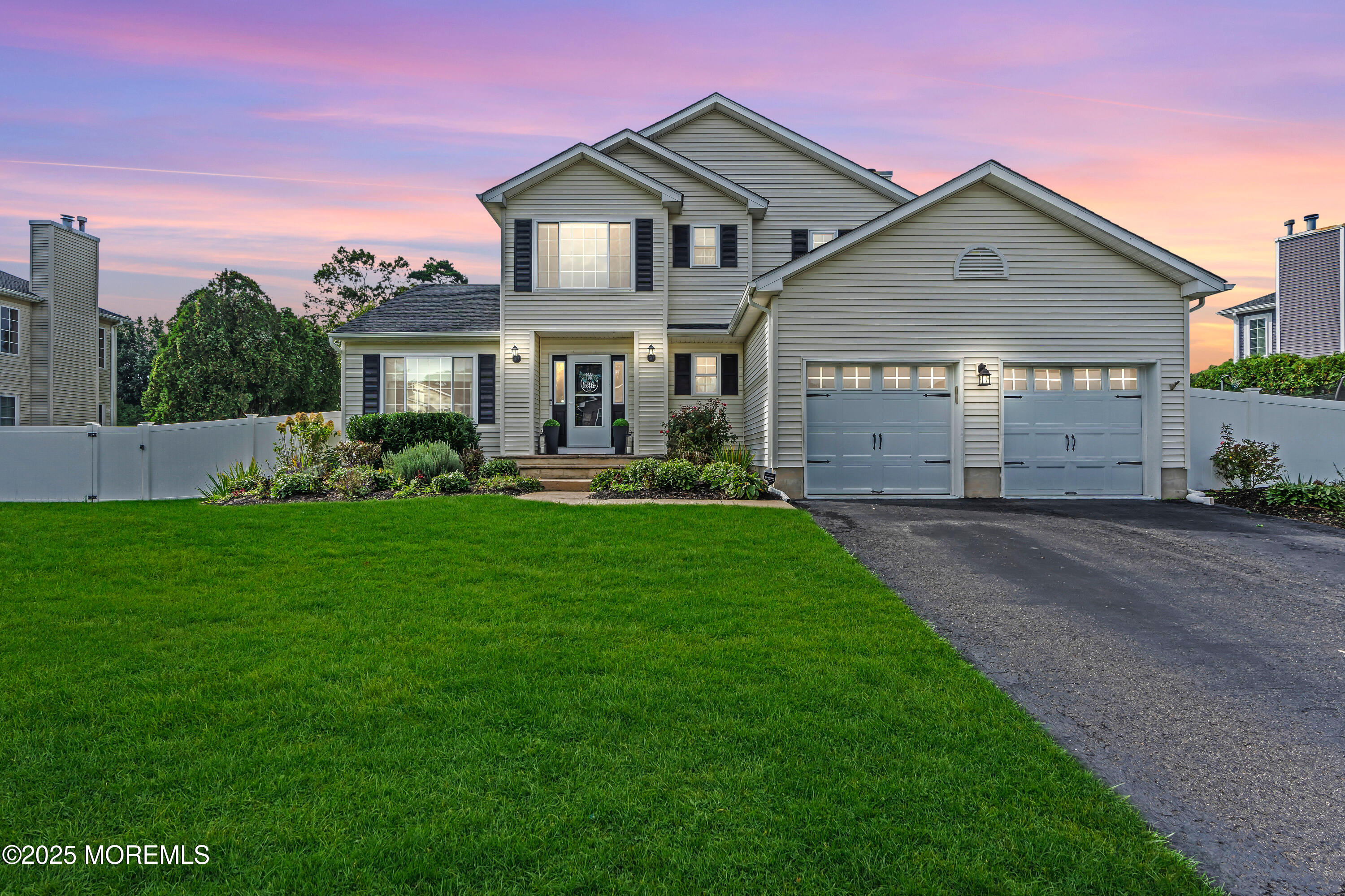 4 Rainbow Drive Howell, NJ 07731 - Photo 36 of 38 a front view of a house with a garden and trees