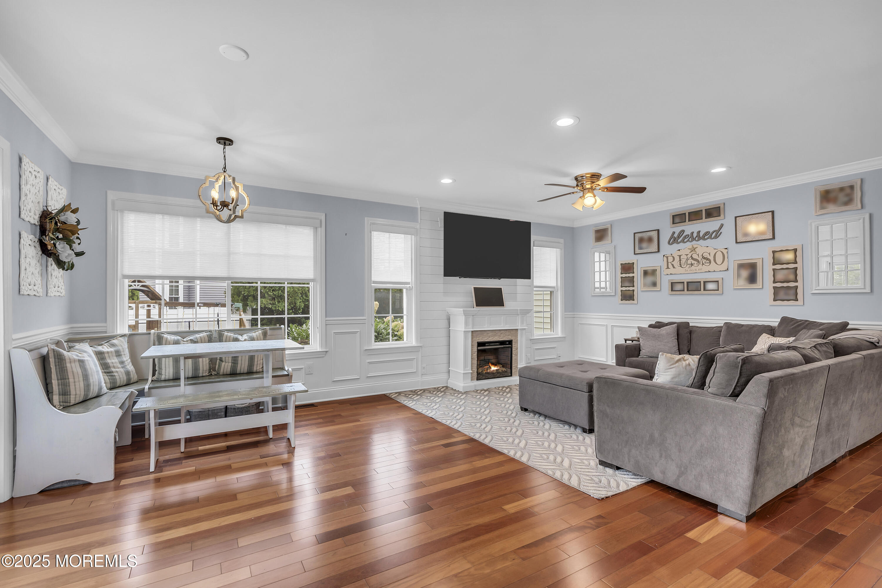 4 Rainbow Drive Howell, NJ 07731 - Photo 7 of 38 a living room with furniture flat screen tv and a fireplace