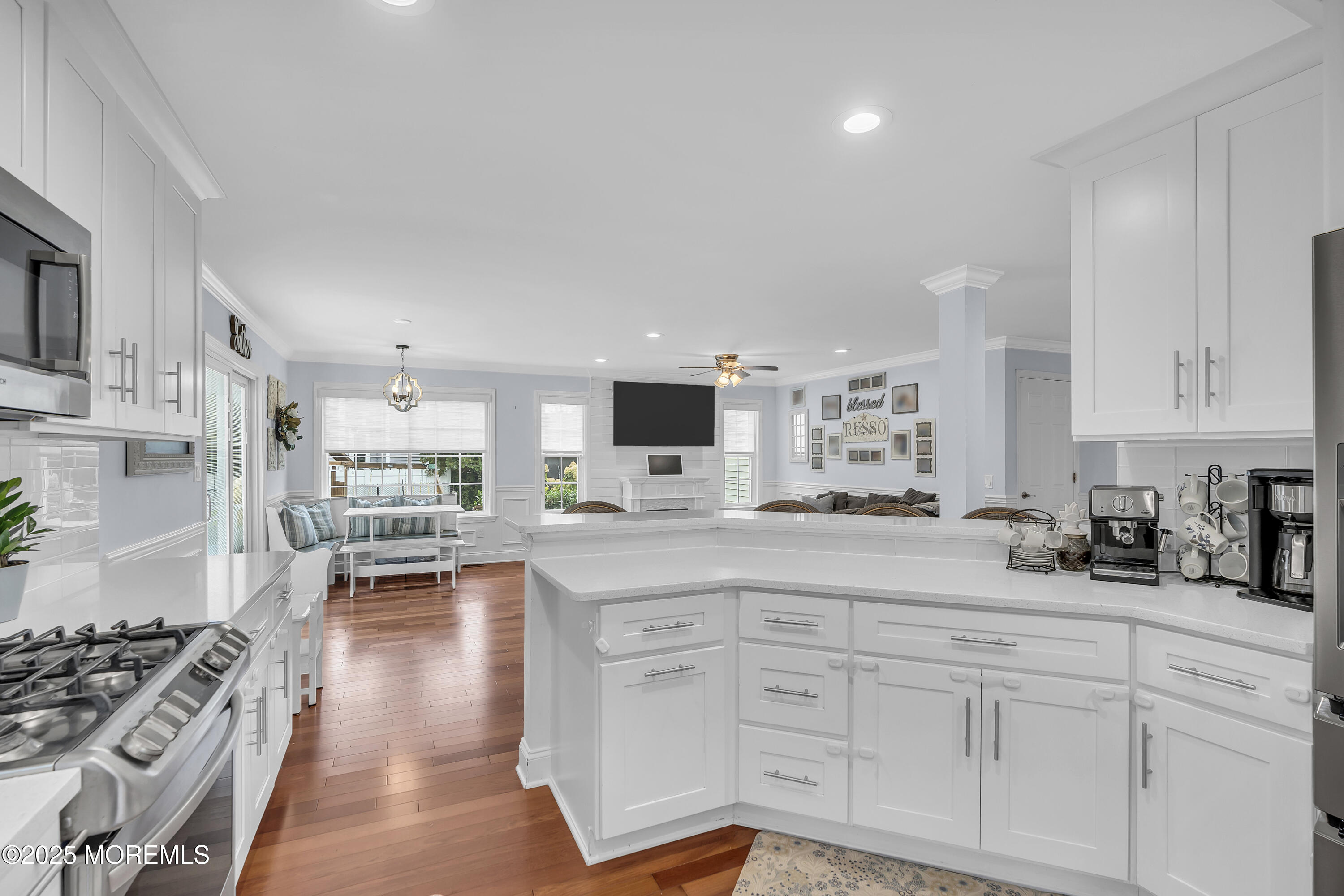 4 Rainbow Drive Howell, NJ 07731 - Photo 10 of 38 a kitchen with white cabinets and appliances