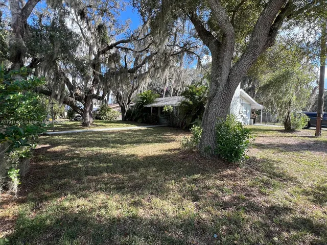 a view of backyard with green space