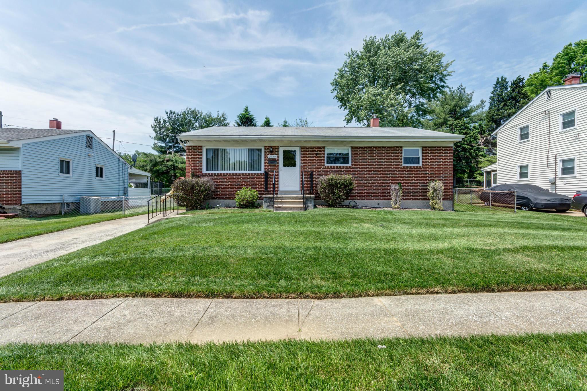 3710 Parkfield Road Baltimore, MD 21244 - Photo 1 of 28 a front view of a house with a yard and trees