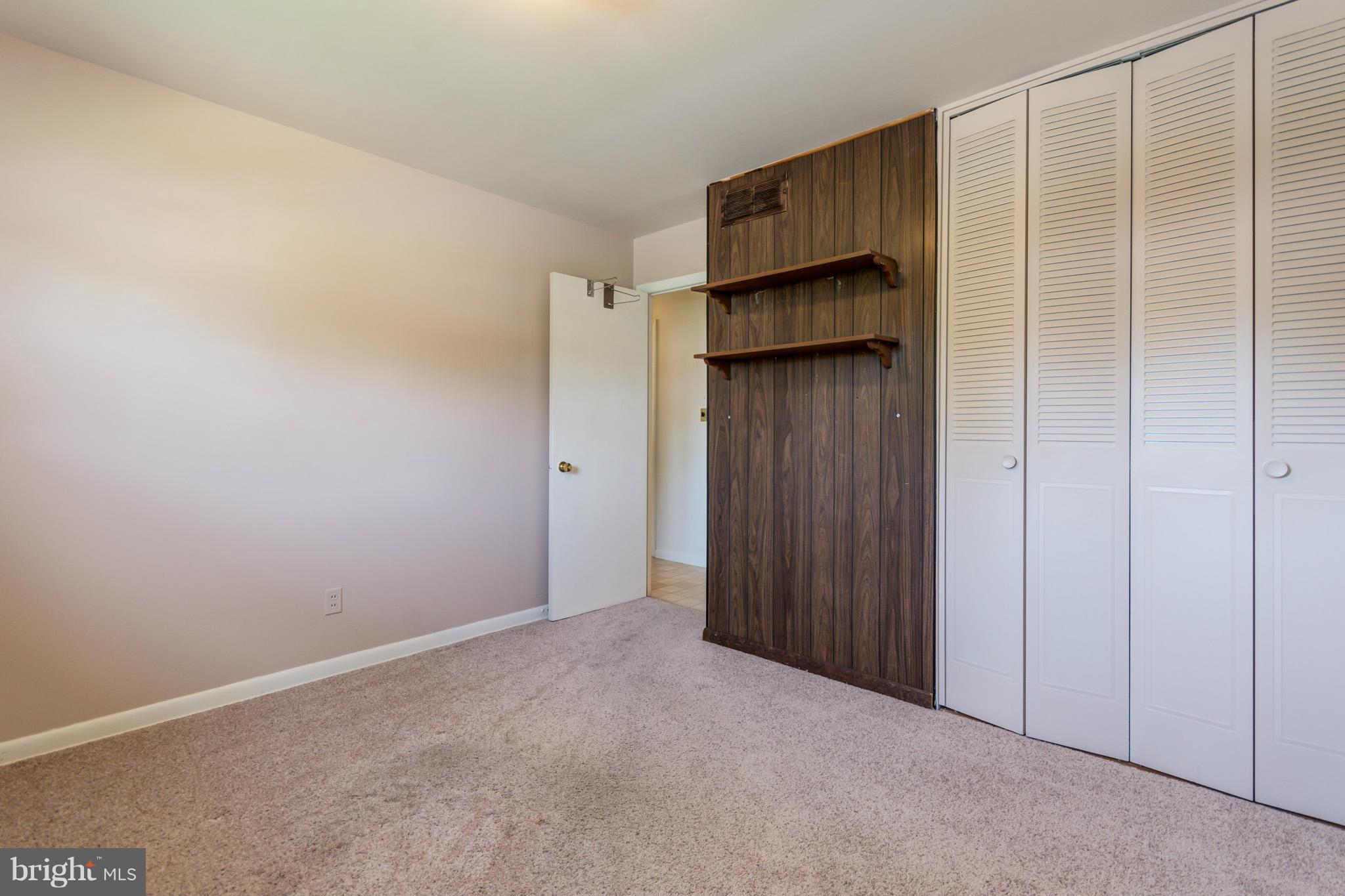 3710 Parkfield Road Baltimore, MD 21244 - Photo 15 of 28 a view of walk in closet with empty racks