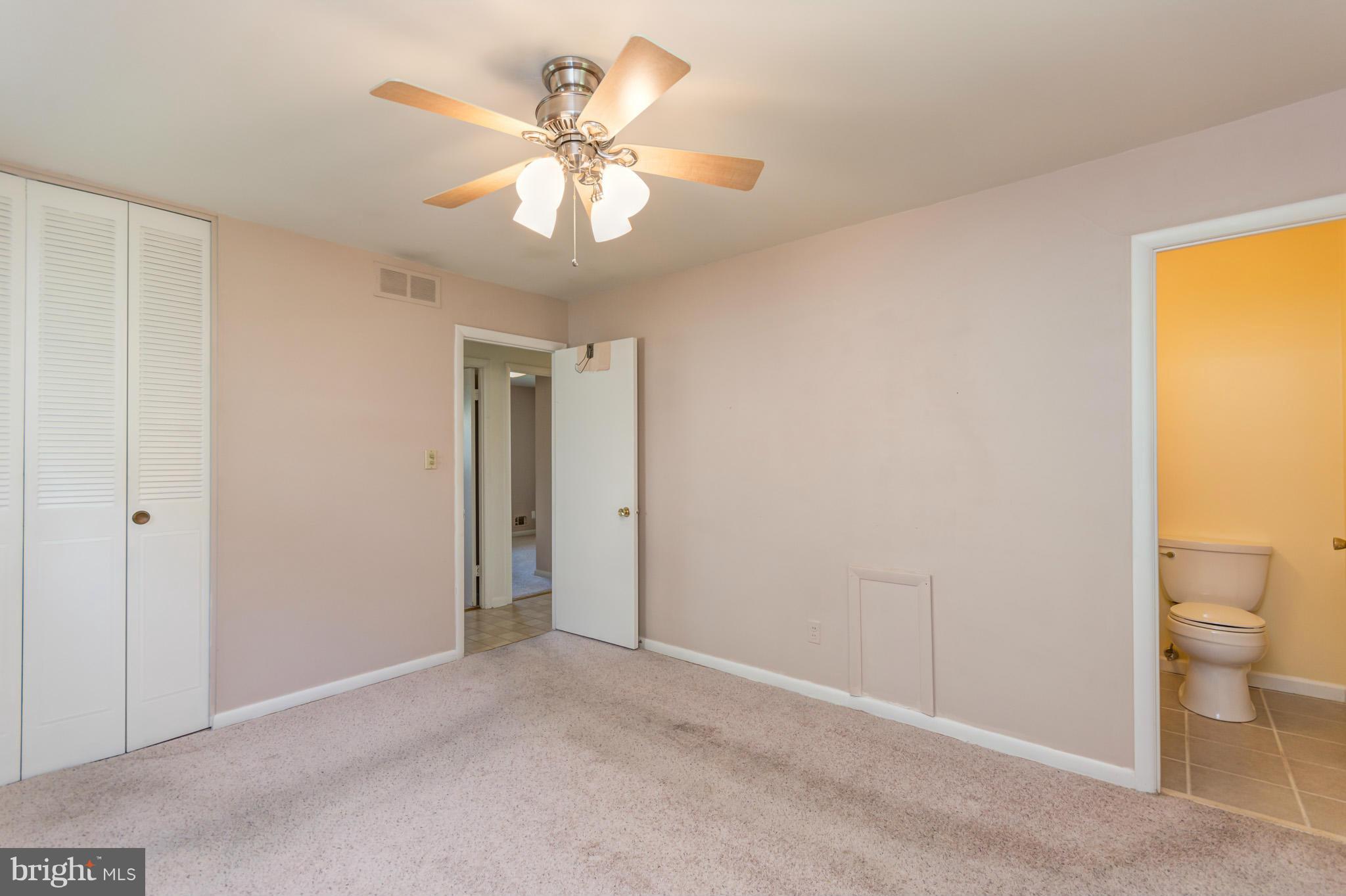 3710 Parkfield Road Baltimore, MD 21244 - Photo 18 of 28 a view of a livingroom with a chandelier fan and a bathroom