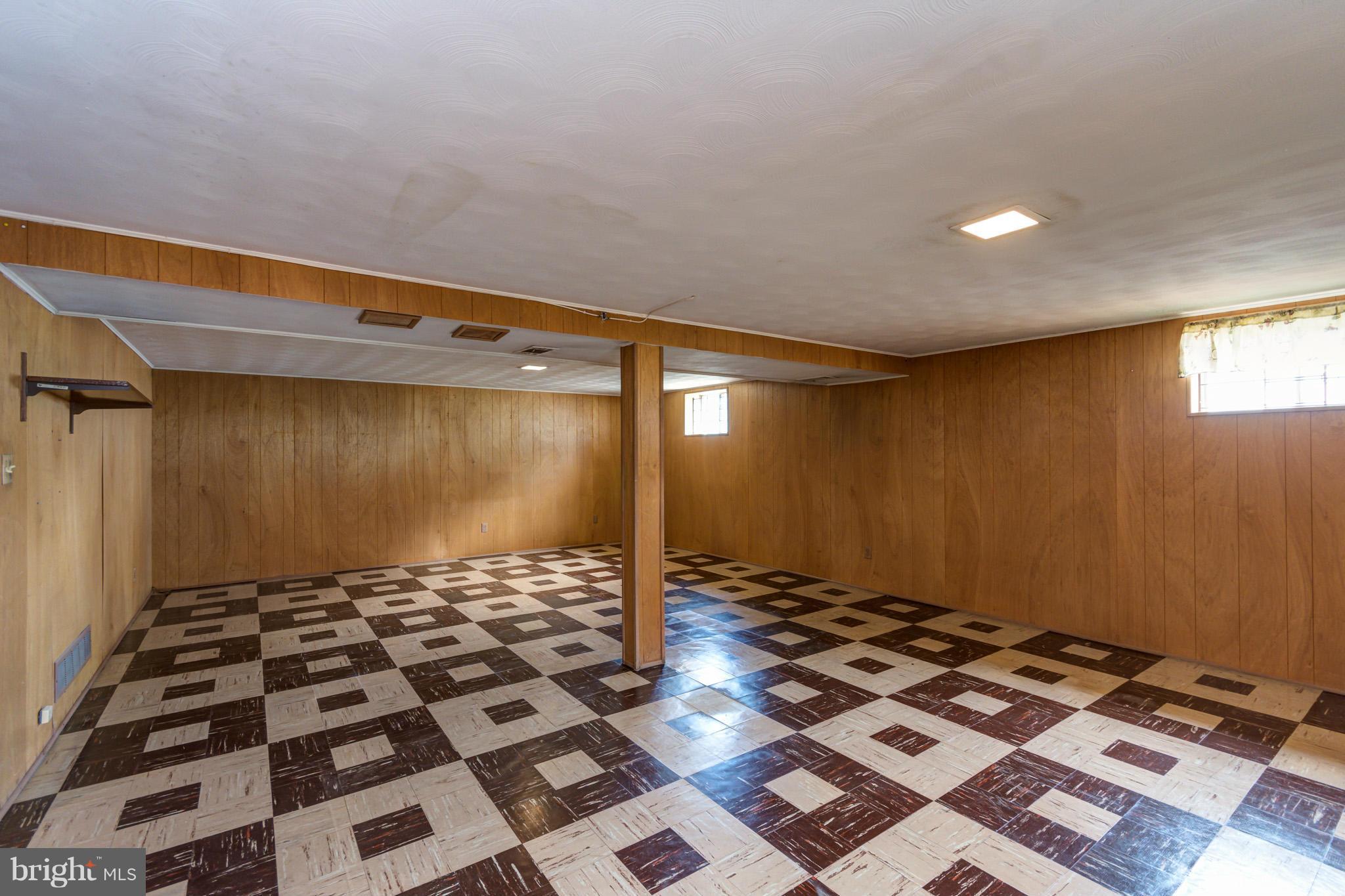 3710 Parkfield Road Baltimore, MD 21244 - Photo 20 of 28 a bathroom with a black and white checkered floor