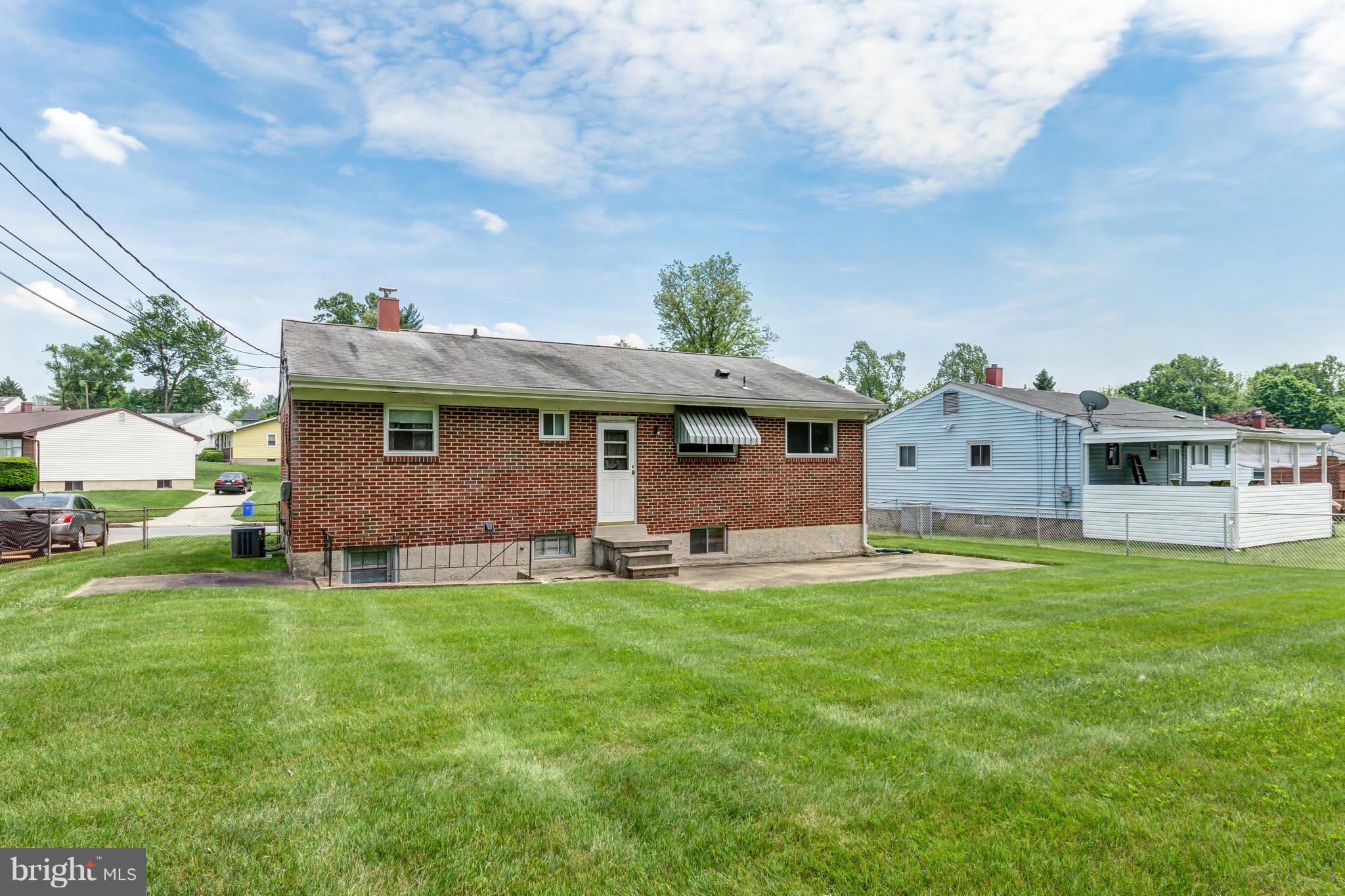 3710 Parkfield Road Baltimore, MD 21244 - Photo 27 of 28 a front view of a house with a garden and deck