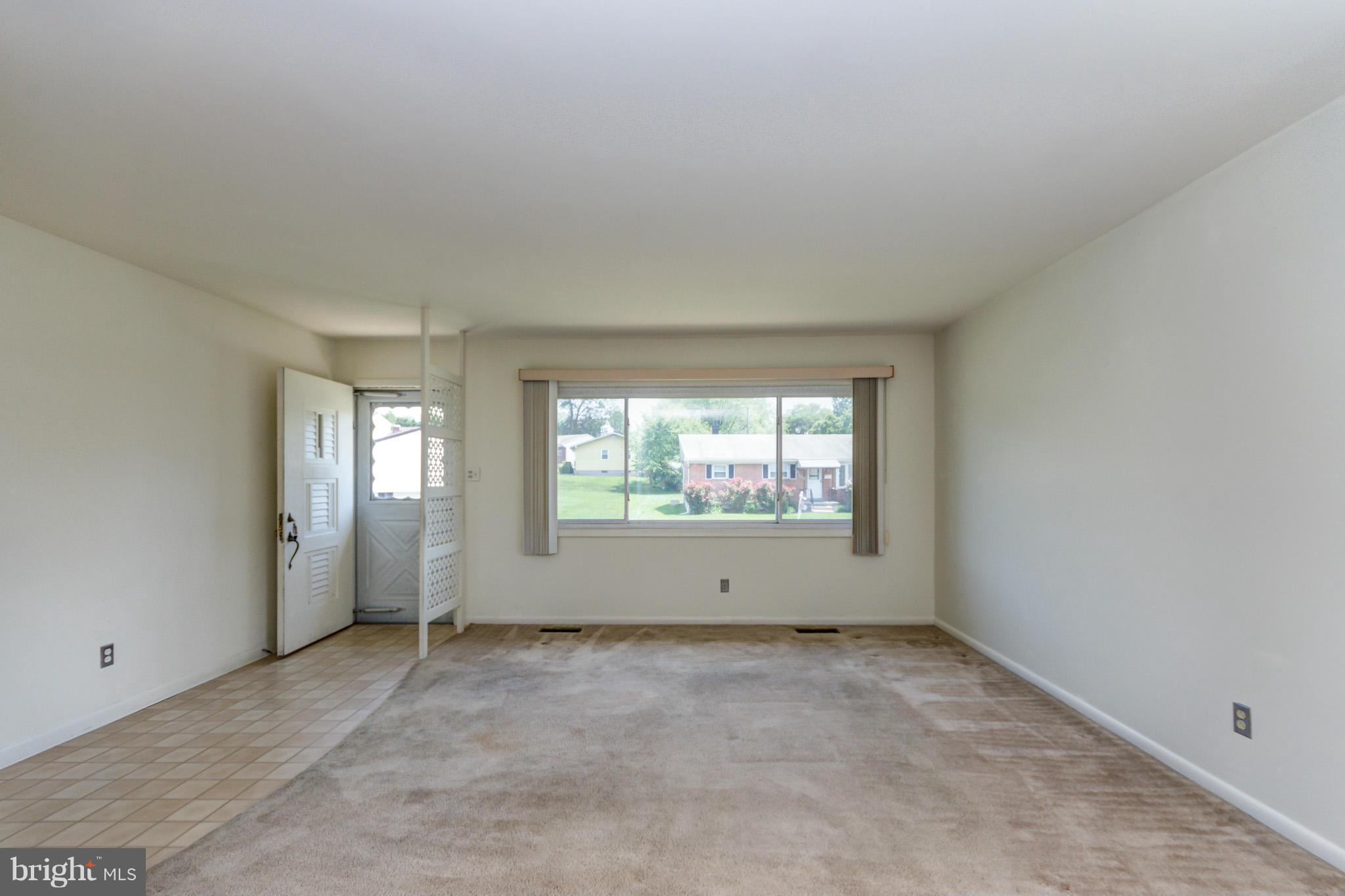 3710 Parkfield Road Baltimore, MD 21244 - Photo 6 of 28 an empty room with windows