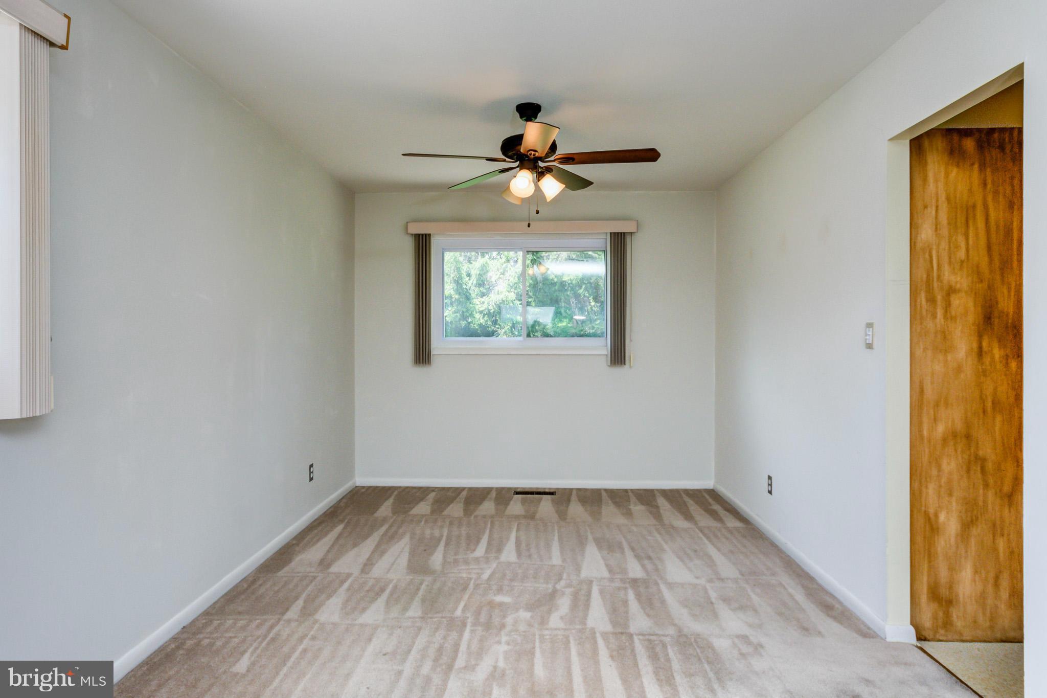 3710 Parkfield Road Baltimore, MD 21244 - Photo 7 of 28 an empty room with windows and fan