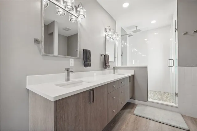 a kitchen with kitchen island a table and chairs in it